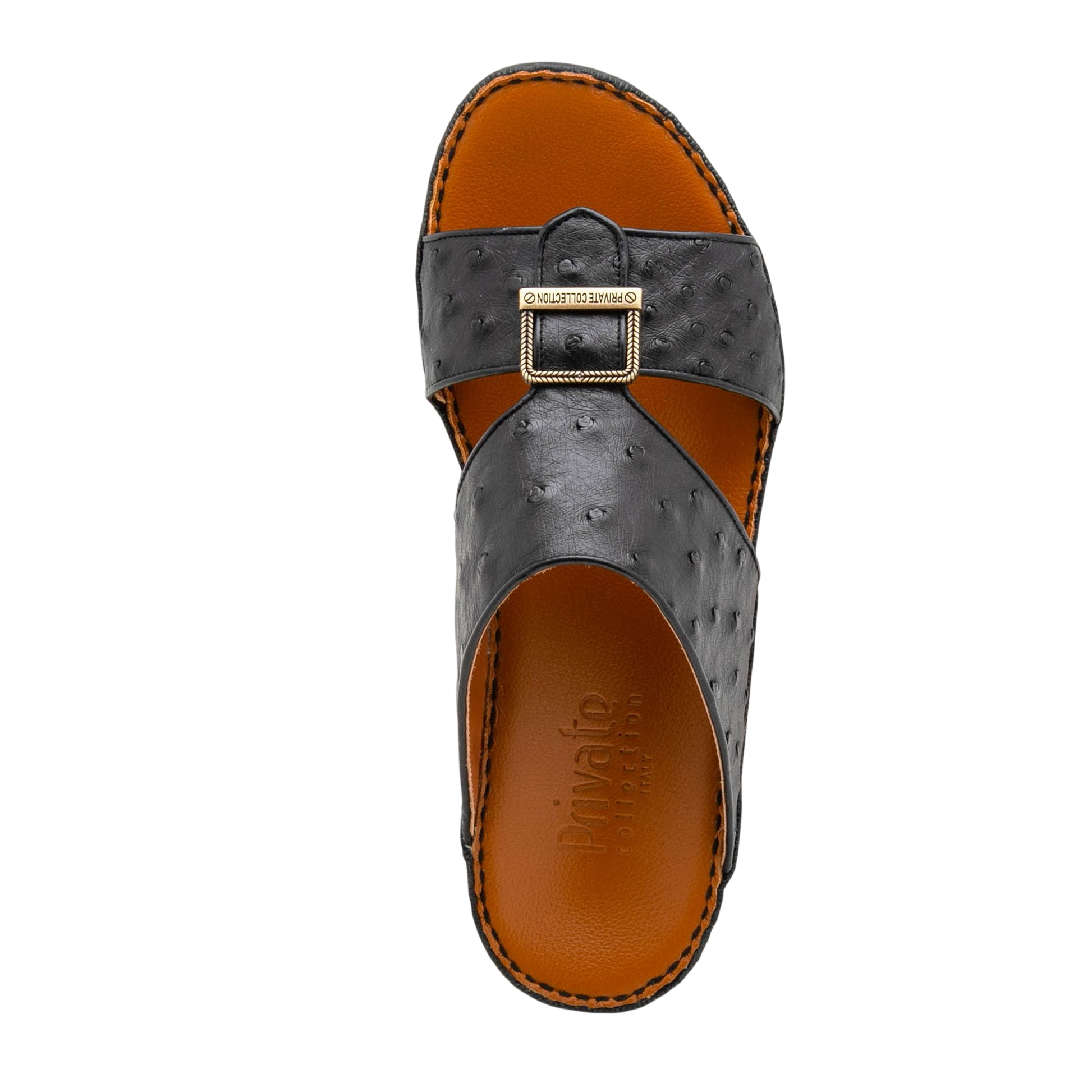 Black luxury leather sandals with textured straps and gold buckle from Private collection