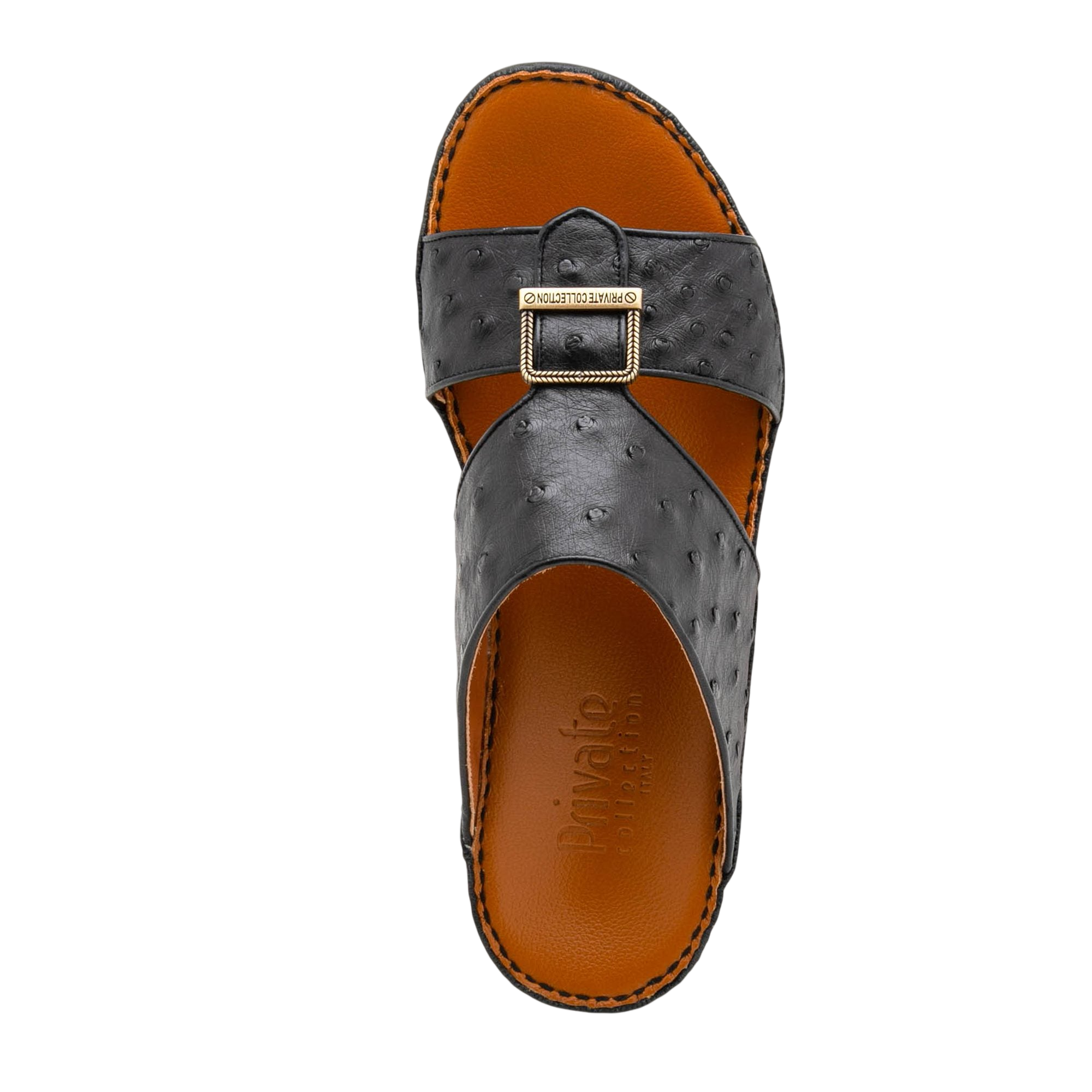 Black luxury leather sandals with textured straps and gold buckle from Private collection