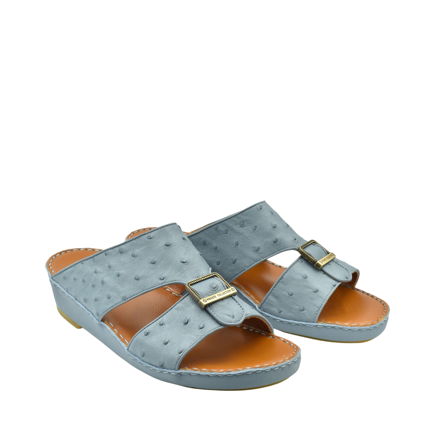 Gray luxury leather sandals with buckle detail and cushioned tan footbed from Private collection