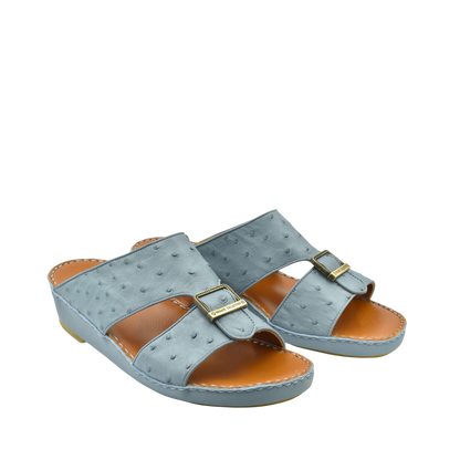 Gray luxury leather sandals with buckle detail and cushioned tan footbed from Private collection