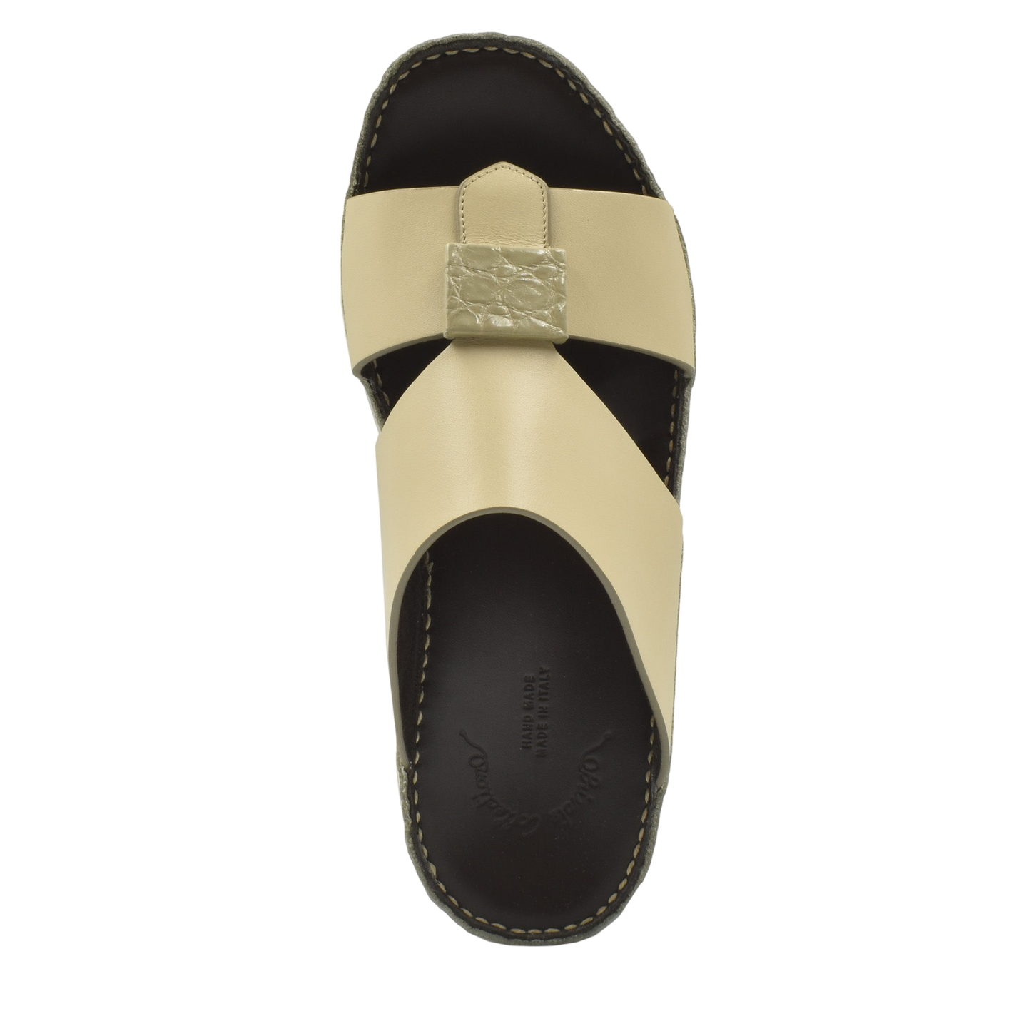 Beige Cerchio buckle sandals with black sole and textured buckle detail from Private Collection
