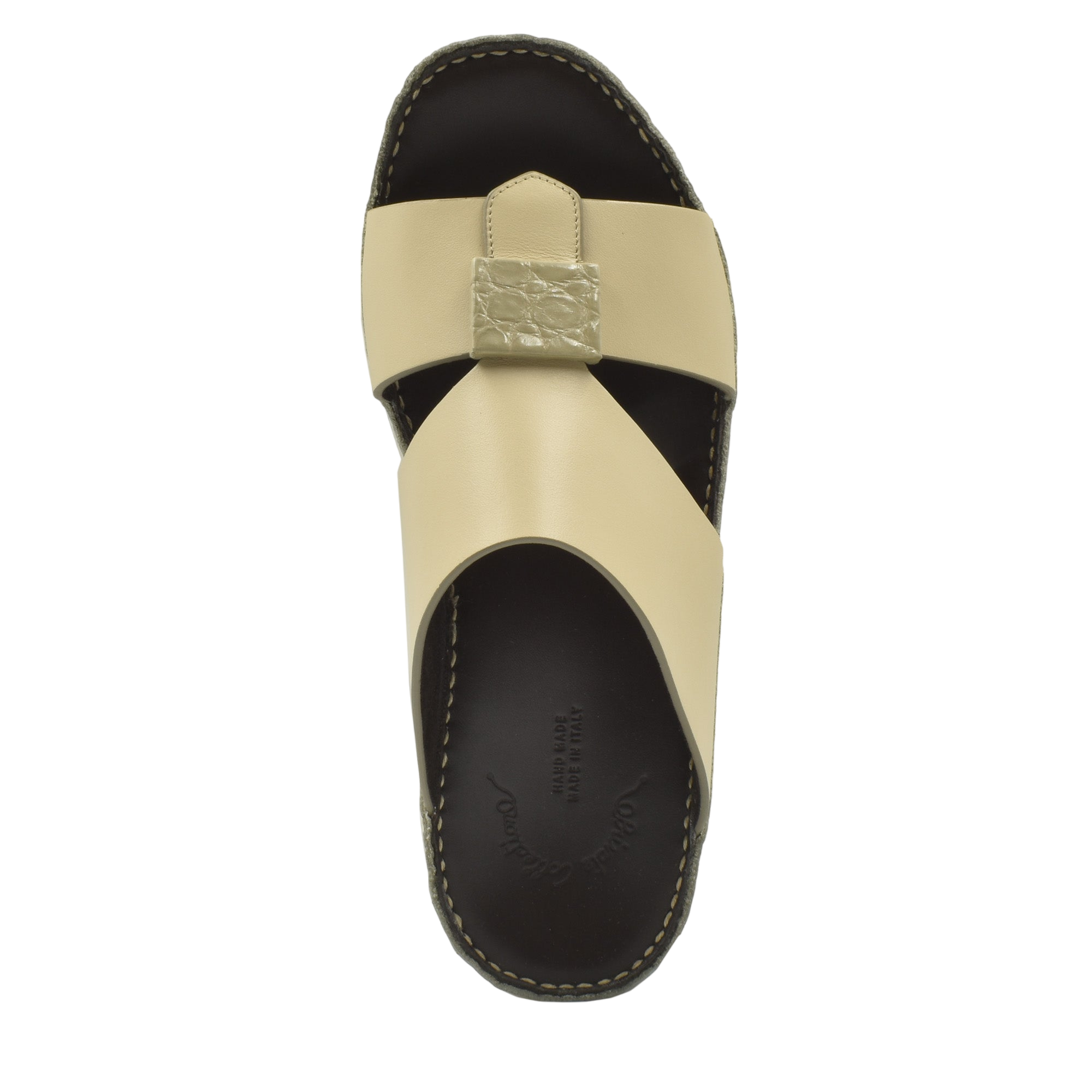 Beige Cerchio buckle sandals with black sole and textured buckle detail from Private Collection