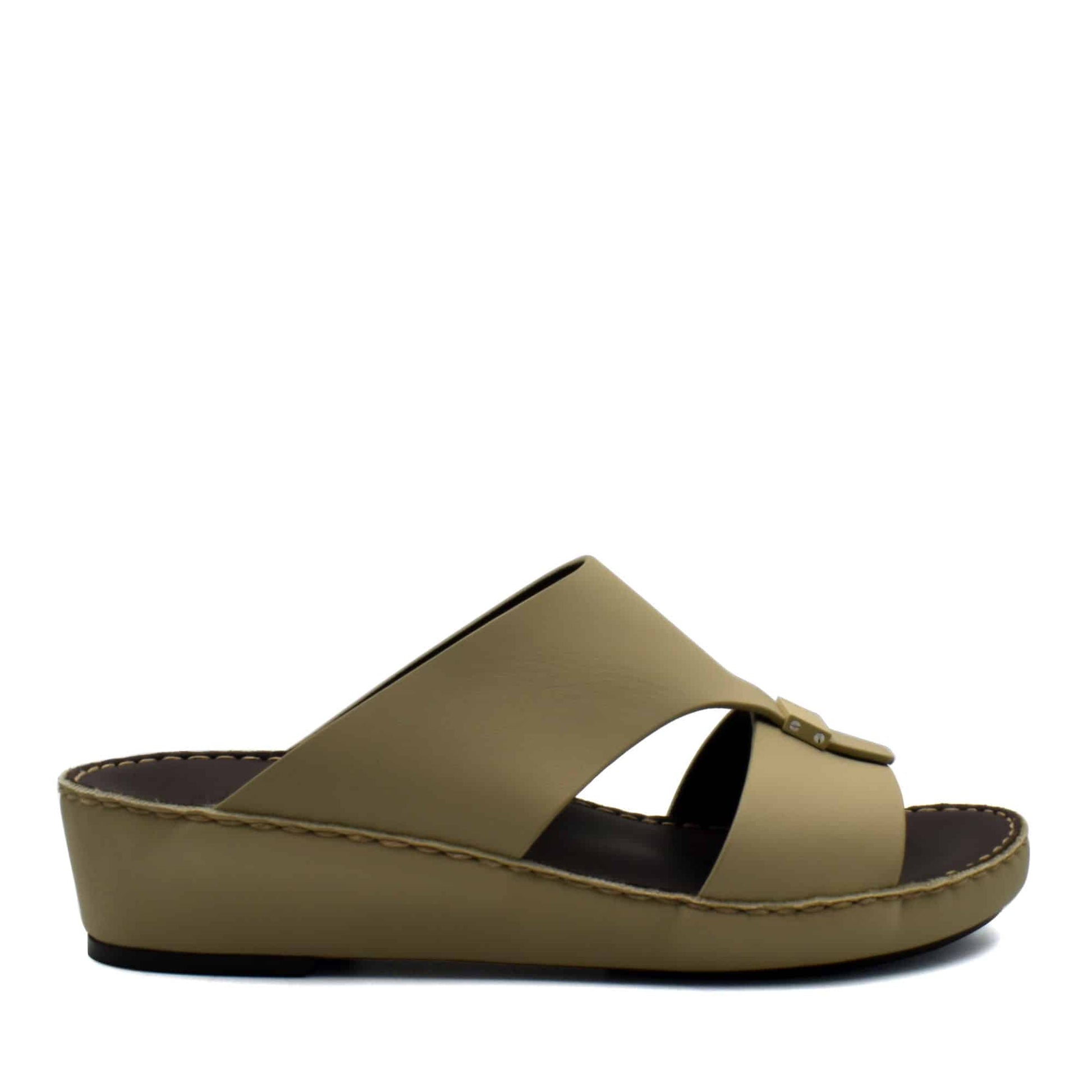 Side view of beige Cerchio Gomato sandals with a wedge sole and crossed straps