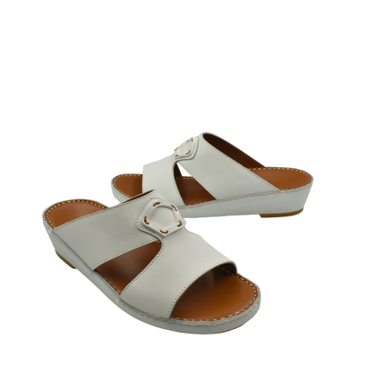 Comfortable leather slip-on sandals in white with a cushioned sole and adjustable buckle strap