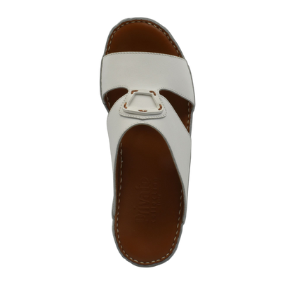 White comfortable leather slip-on sandals with stitched brown sole from Private collection