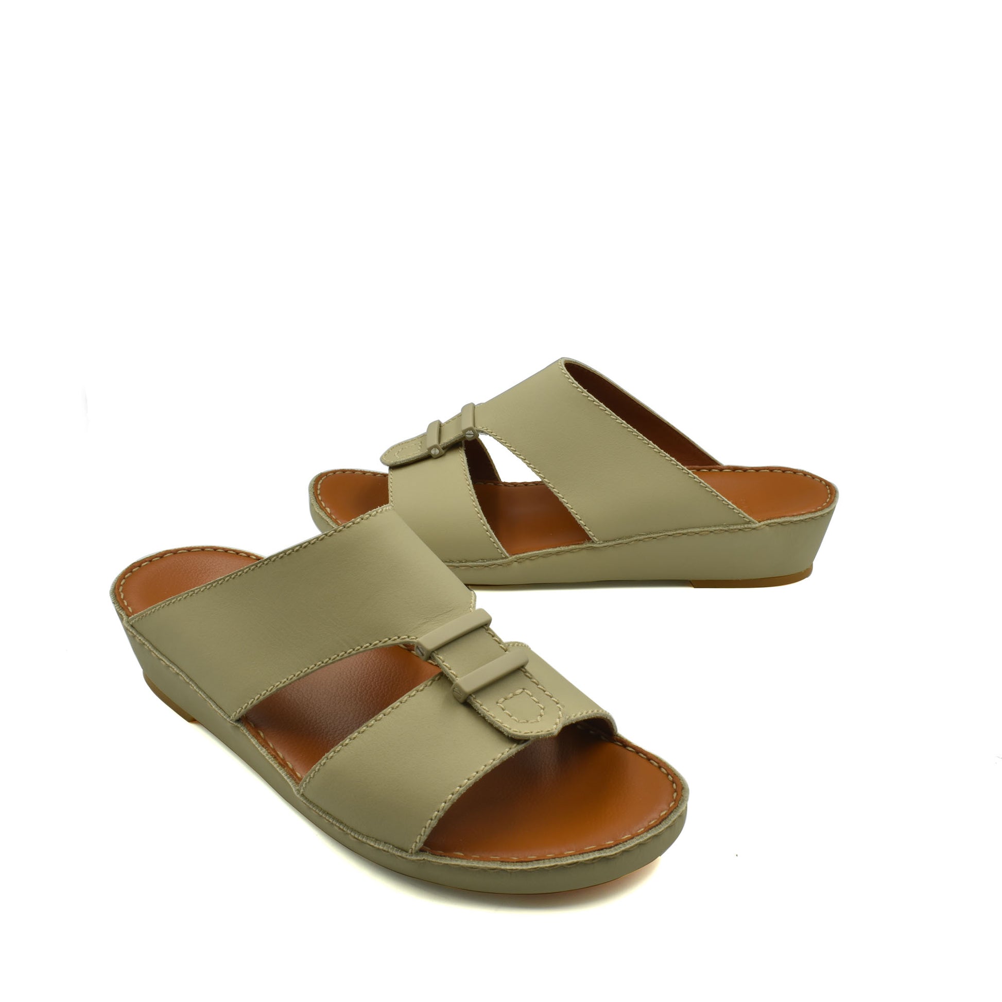 Beige comfortable rubber sandals with wide straps and cushioned footbed for everyday wear