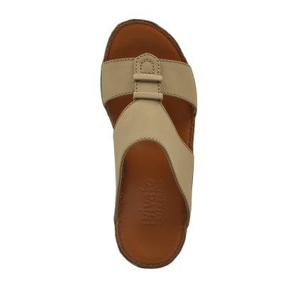 Top view of beige comfortable rubber sandals with a wide strap and cushioned sole