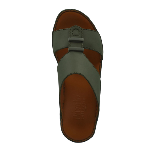 Top view of comfortable rubber sandals with green straps and brown footbed from private collection