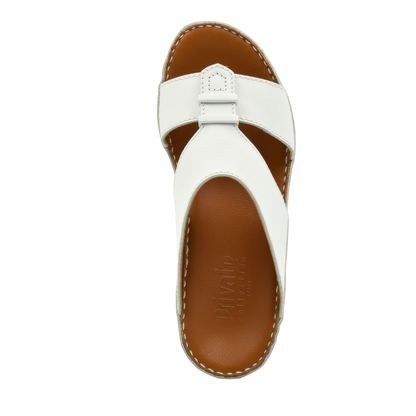 White comfortable rubber sandals with brown cushioned footbed and stitched edges