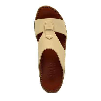 Beige comfortable rubber slides with brown cushioned footbed and stitched sole from Private Collection