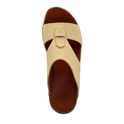 Beige comfortable rubber slides with brown cushioned footbed and stitched sole from Private Collection
