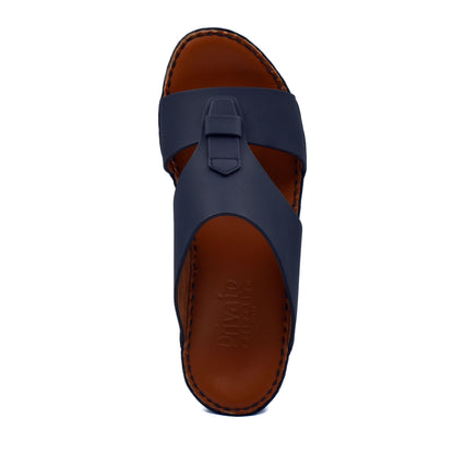 Top view of comfortable rubber slides in navy blue with brown cushioned sole from Private Collection