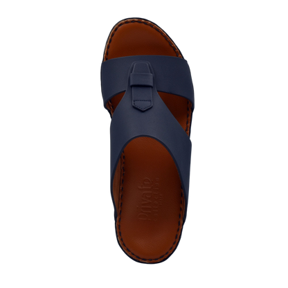 Top view of comfortable rubber slides in navy blue with brown cushioned sole from Private Collection