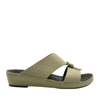 Beige deercalf leather sandals with quilted straps and low wedge sole for comfortable wear