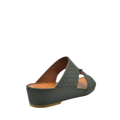 Black designer leather sandals with quilted straps and cushioned tan insole from Private Collection