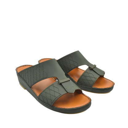 Pair of designer leather sandals in dark green with stitched detailing and tan cushioned footbed