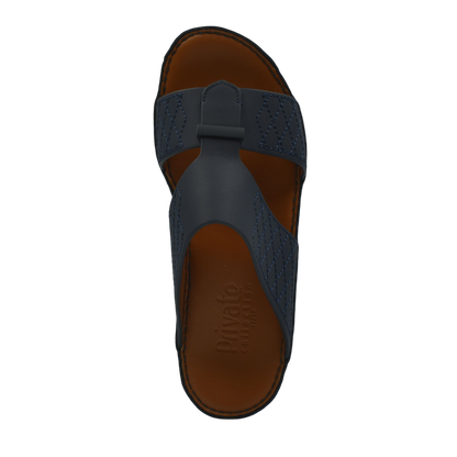Top view of black designer leather sandals with brown footbed from private collection