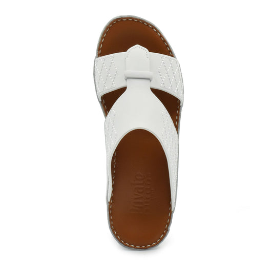 White designer leather sandals with brown footbed and stitched detailing from Private collection