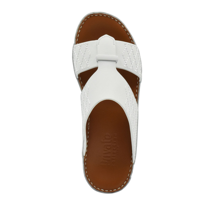 White designer leather sandals with brown footbed and stitched detailing from Private collection