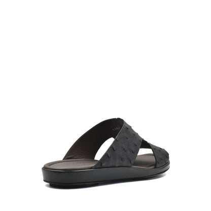 Black ostrich skin slide sandals with open toe and comfortable cushioned sole