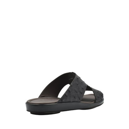 Black ostrich skin slide sandals with open toe and comfortable cushioned sole
