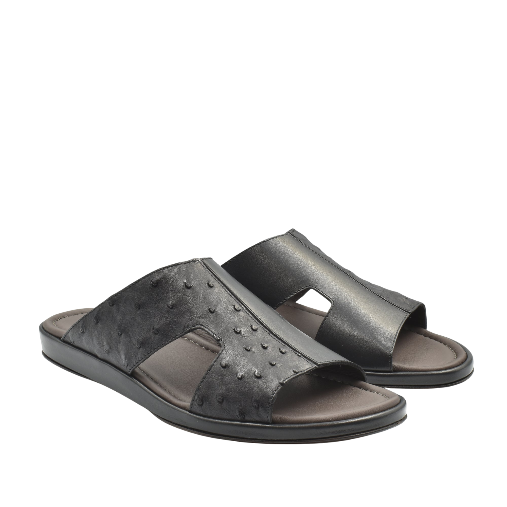 Black ostrich skin slide sandals with open toe design and cushioned footbed
