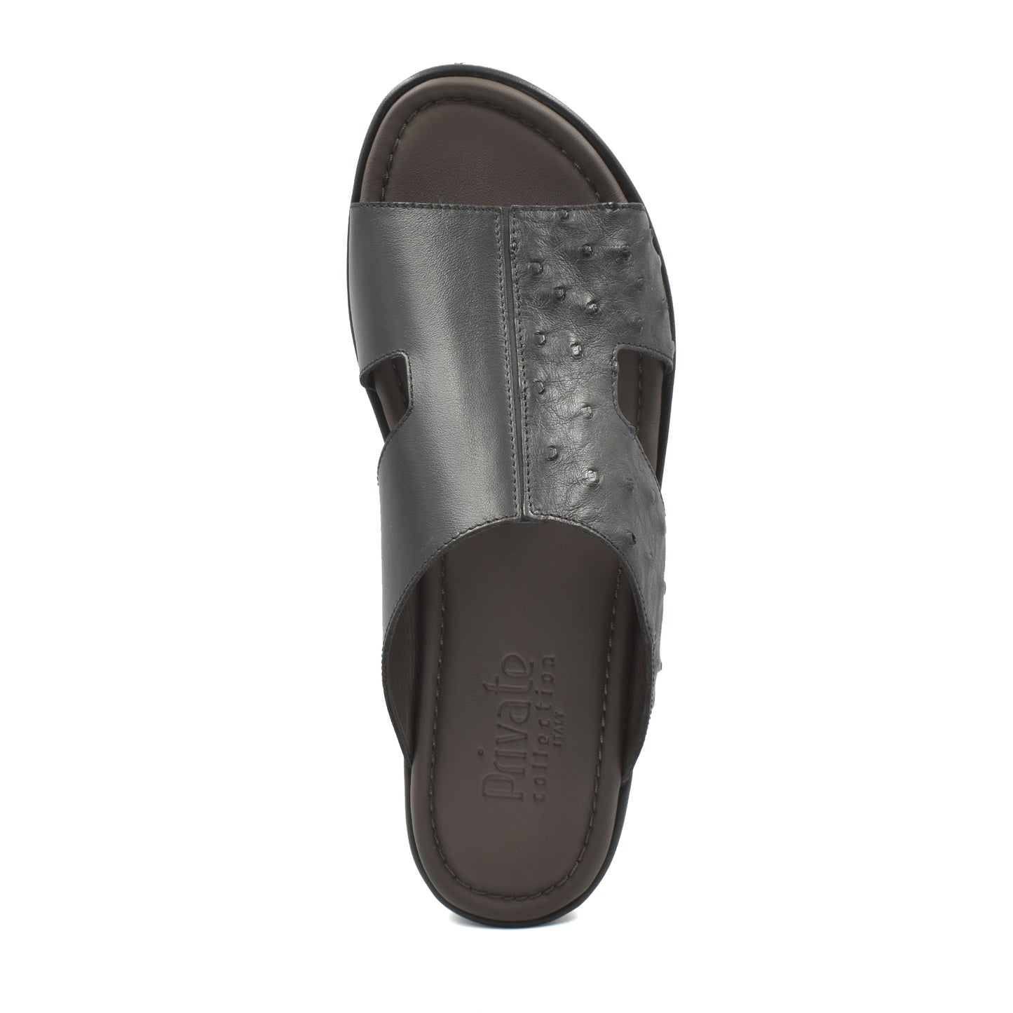 Black ostrich skin slide sandals from Private Collection with textured upper and open toe design