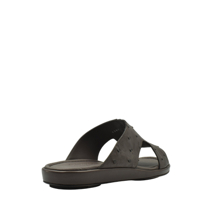 Brown ostrich skin slide sandals with textured upper and cushioned sole for comfortable wear