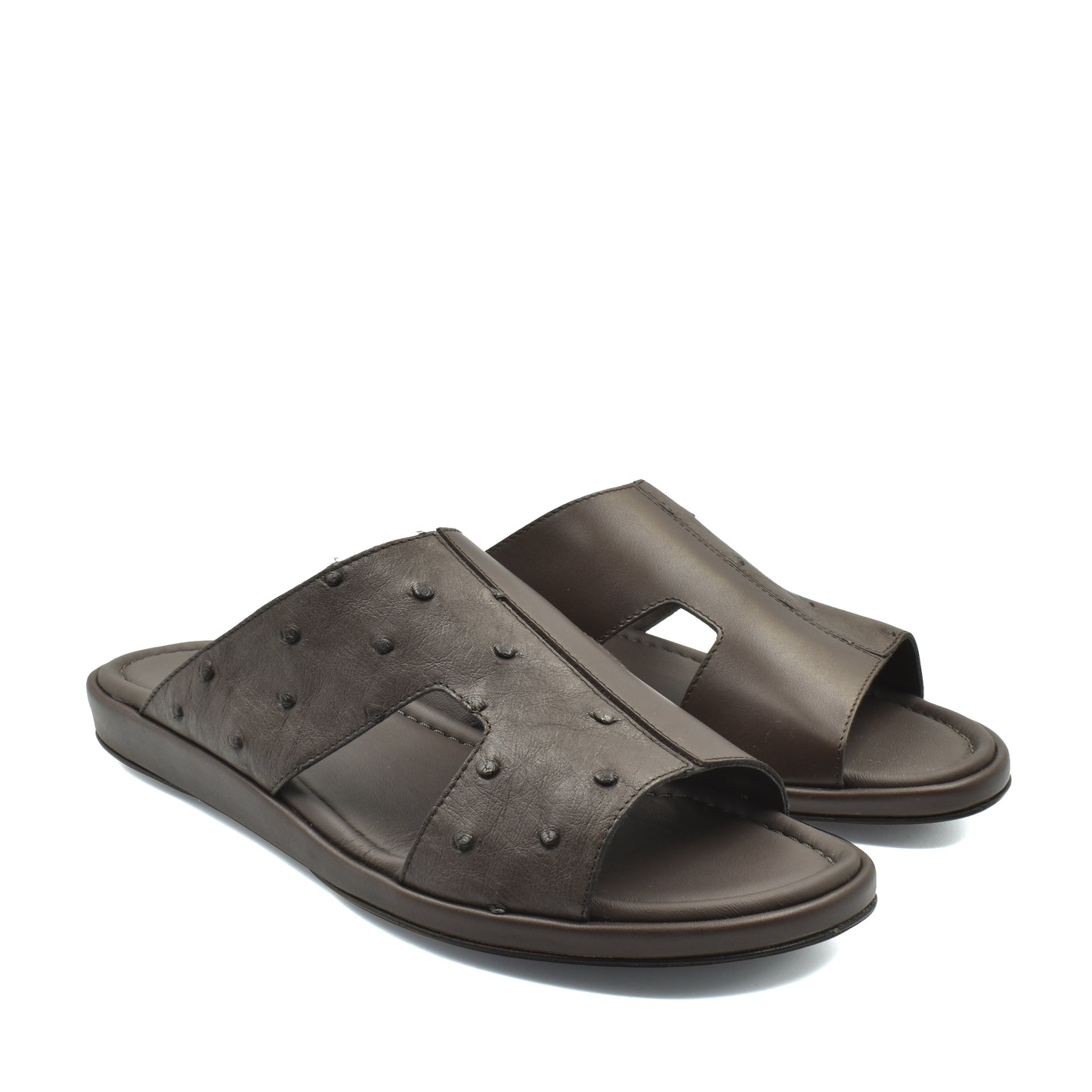 Brown ostrich skin slide sandals with textured leather and open toe design for comfortable wear