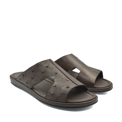 Brown ostrich skin slide sandals with textured leather and open toe design for comfortable wear