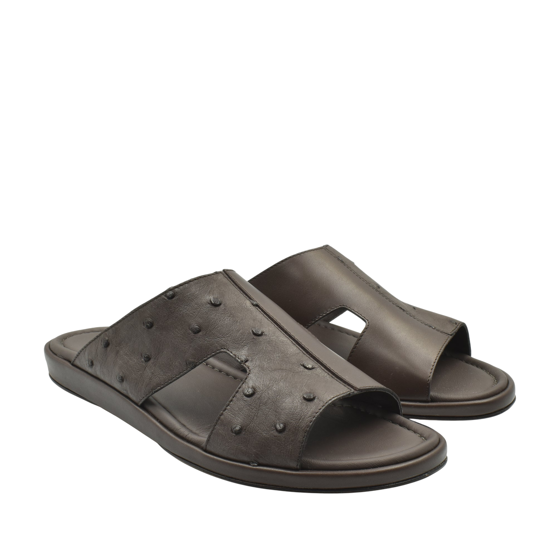 Brown ostrich skin slide sandals with textured leather and open toe design for comfortable wear