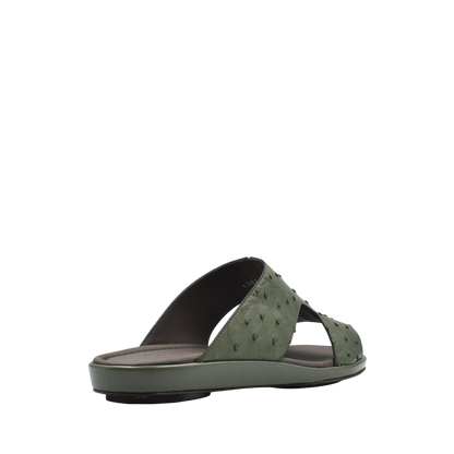 Green ostrich skin slide sandals with textured leather straps and cushioned sole from private collection