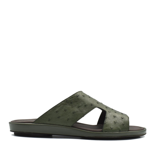 Green ostrich skin slide sandals with textured leather upper and flat sole for casual wear