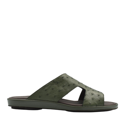 Green ostrich skin slide sandals with textured leather upper and flat sole for casual wear