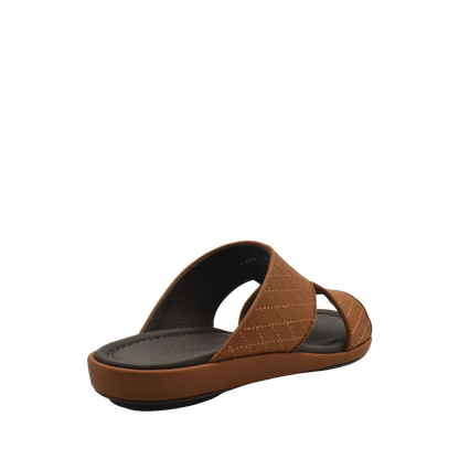 Brown luxury arca sandals with quilted straps and cushioned footbed in a slip-on design