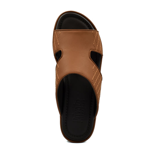 Top view of brown luxury arca sandals with black cushioned footbed from Private collection