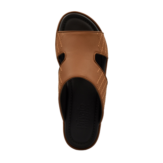 Top view of brown luxury arca sandals with black cushioned footbed from Private collection