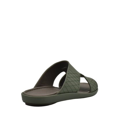 Green slip-on luxury arca sandals with quilted straps and cushioned footbed