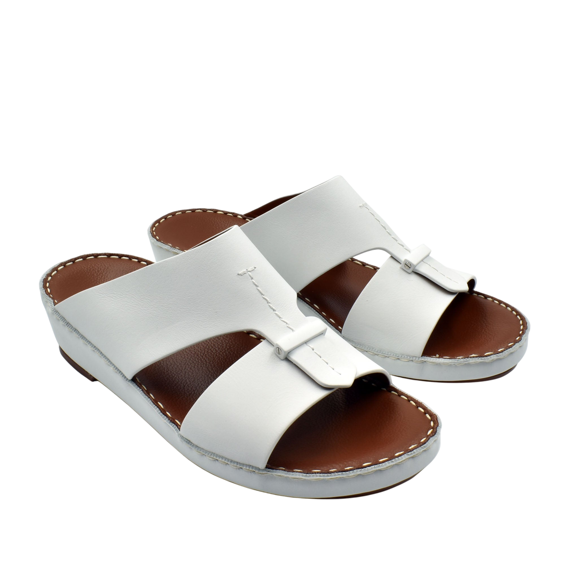 White leather luxury comfort sandals with cushioned brown footbed and slip-on design