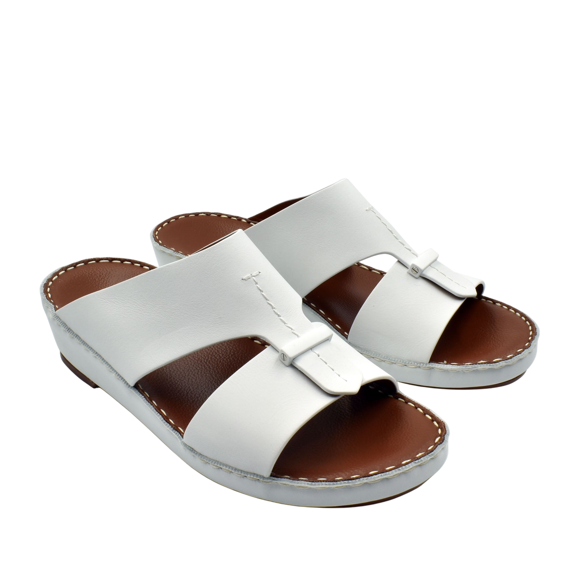 White leather luxury comfort sandals with cushioned brown footbed and slip-on design