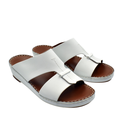White leather luxury comfort sandals with cushioned brown footbed and slip-on design