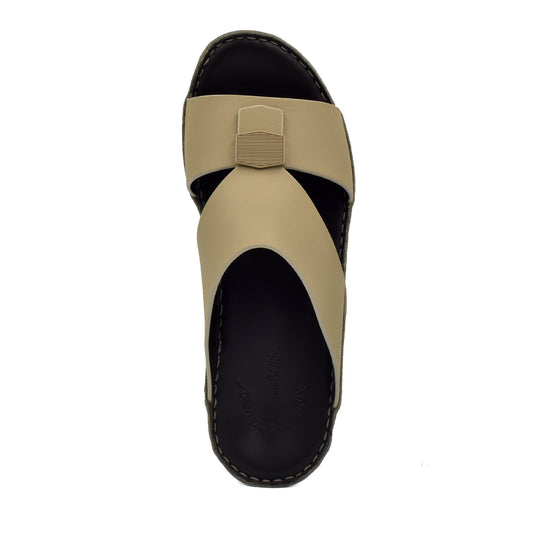 Top view of beige Esagono Gomato shoes with black sole and unique cross strap design