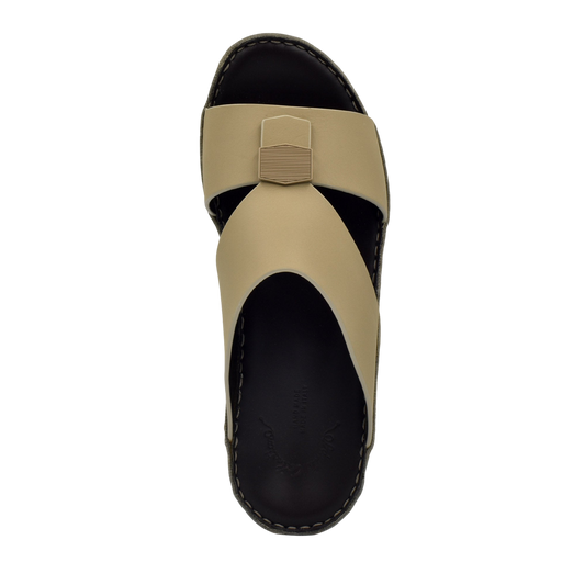Top view of beige Esagono Gomato shoes with black sole and unique cross strap design