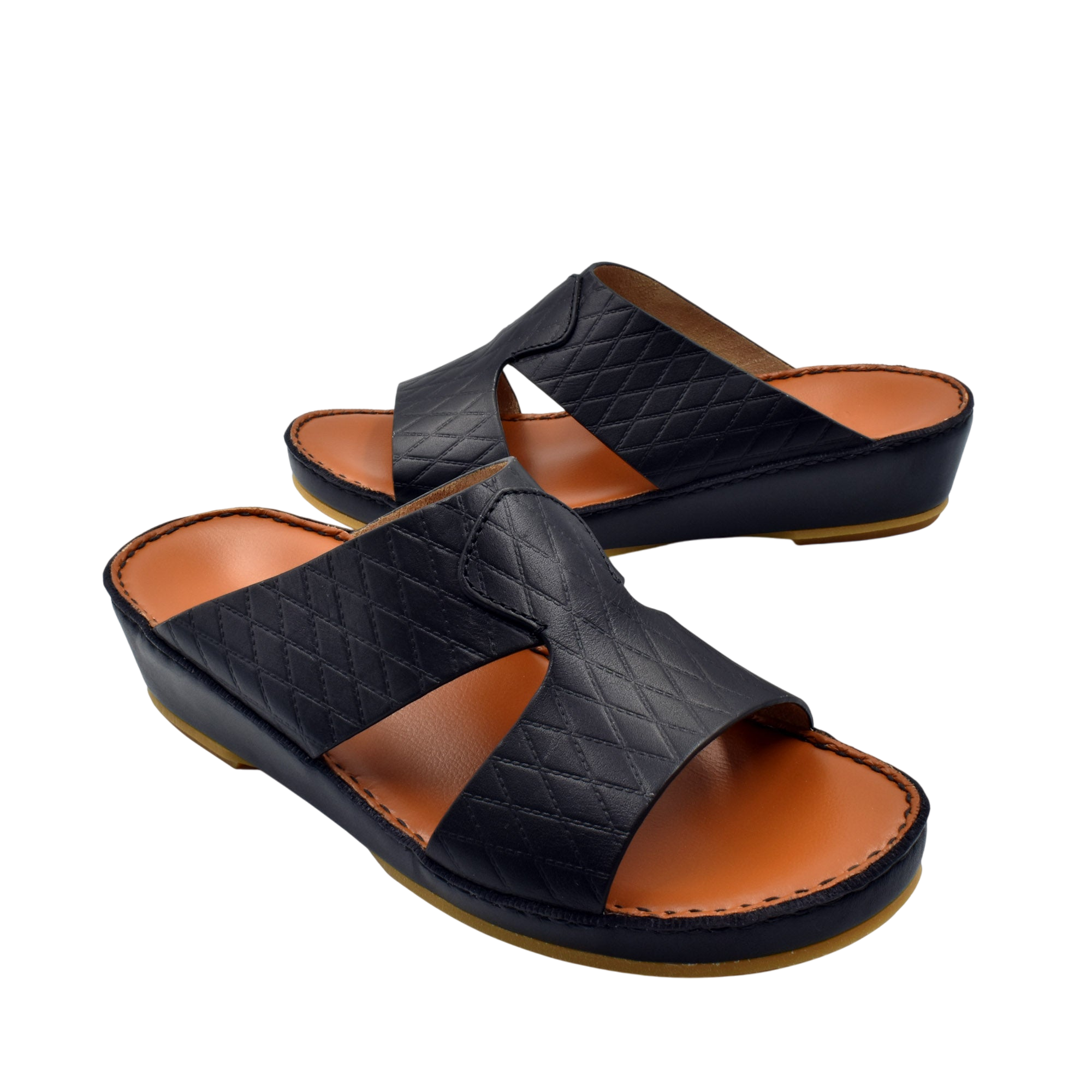 Black handcrafted Italian sandals with quilted leather straps and cushioned tan footbed by Private Collection
