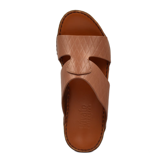 Top view of a brown handcrafted Italian sandals with textured leather straps and stitched sole