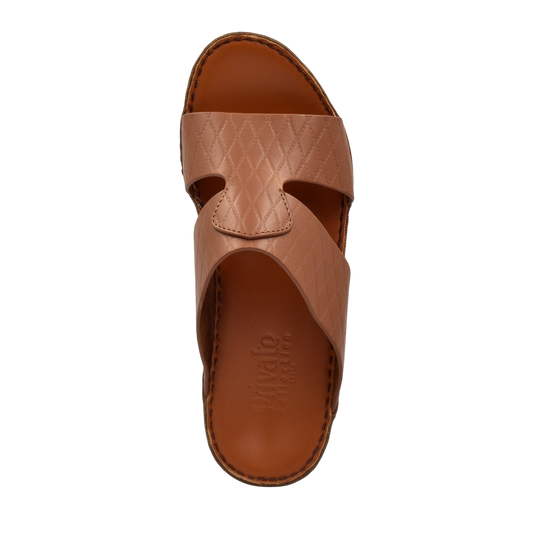 Top view of a brown handcrafted Italian sandals with textured leather straps and stitched sole