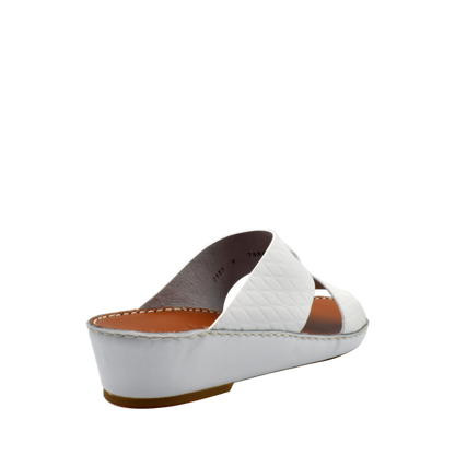 White handcrafted Italian sandals with quilted straps and low wedge heel from Private Collection