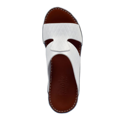 White handcrafted Italian sandals with quilted leather straps and brown footbed by Private Collection