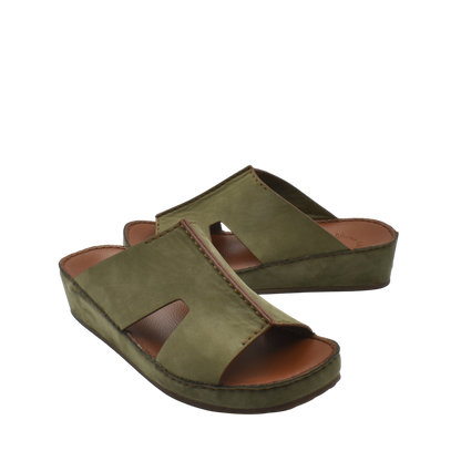 Green handcrafted leather shoes with open toe and cushioned sole from private collection