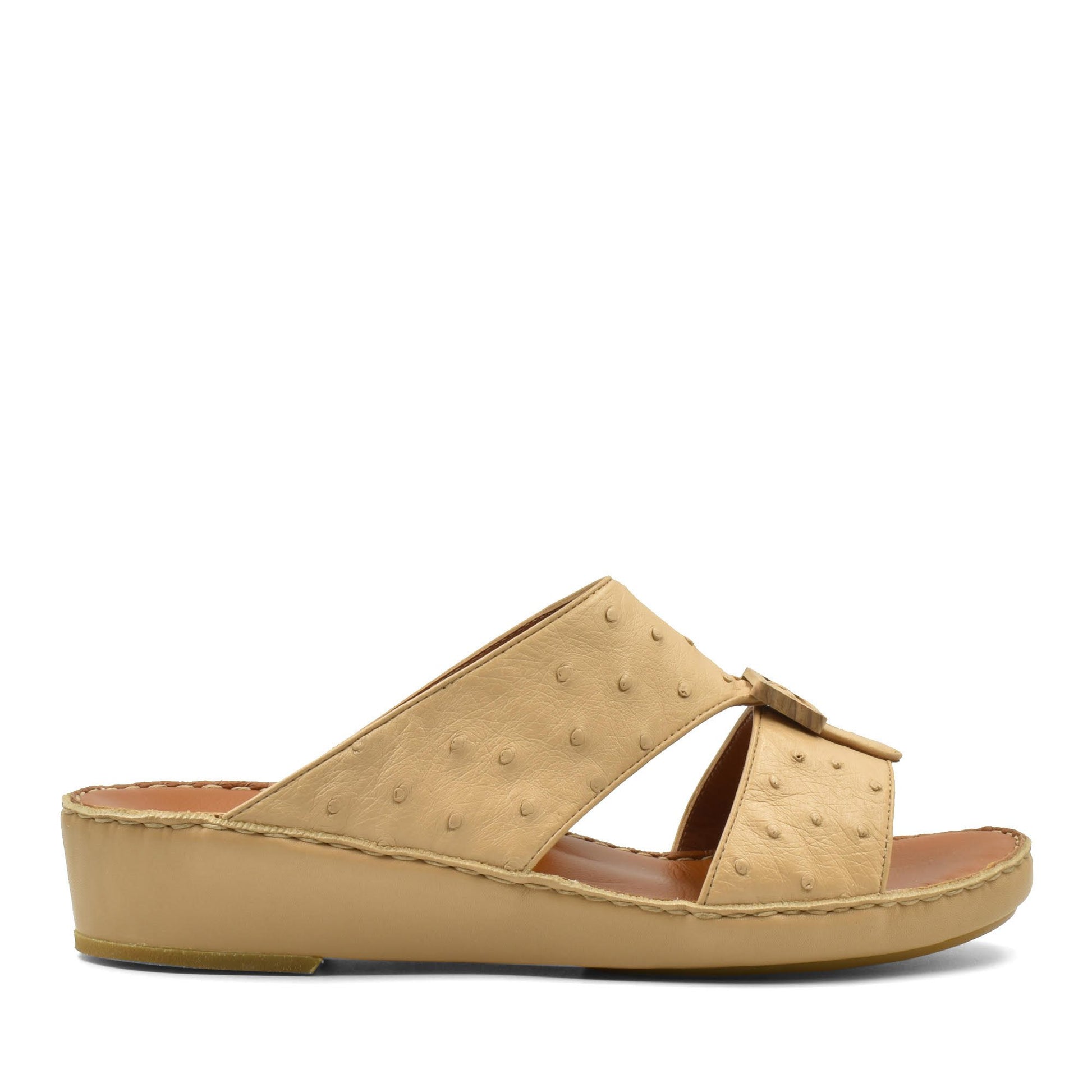 Handcrafted olive sandals with textured straps and cushioned sole in beige tone
